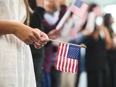 person holding American flag